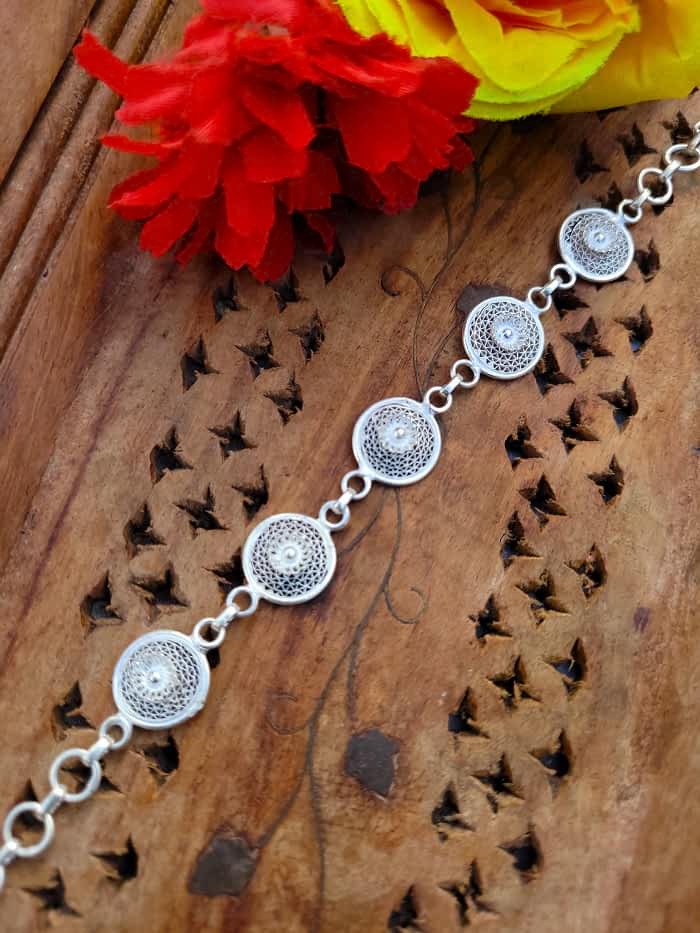 Close-up of the Celestial Circles Bracelet’s intricate filigree design.