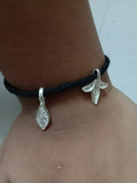 Black thread anklet cum bracelet for baby