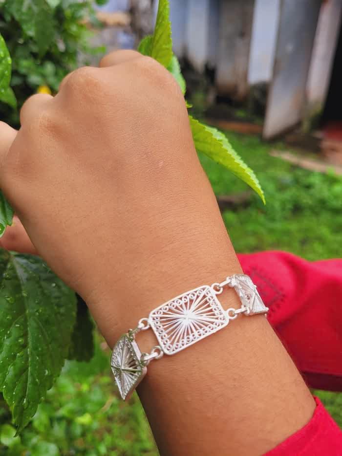 
                      
                        Silver filigree bracelet in Tarakasi wok of Cuttack Silver Linings
                      
                    