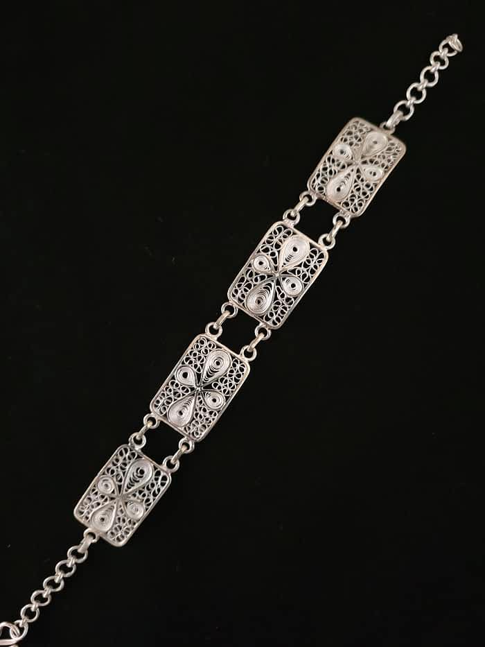 
                      
                        Discover the exquisite beauty of this handcrafted Tarakasi silver filigree bracelet
                      
                    