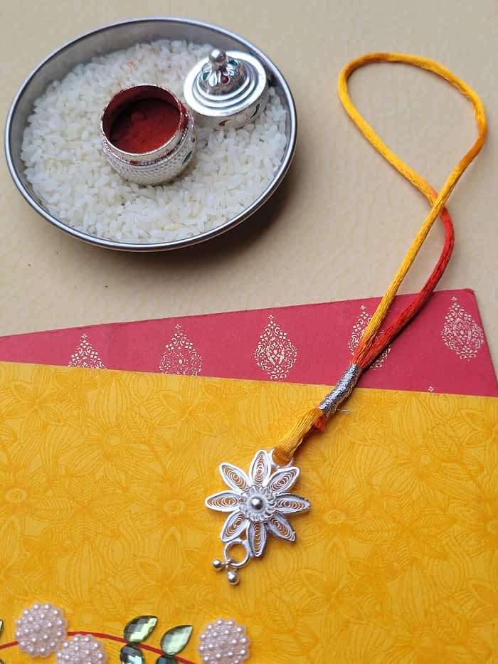 
                      
                        Divine - Silver Rakhi and Lumba Set
                      
                    