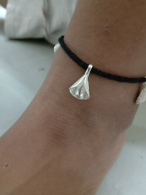 Black thread anklet cum bracelet for baby